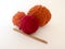 Bright balls of wool on white background with a wooden crochet h