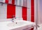Bright bathroom interior in red and white colors