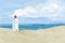 Bright beach sand dunes with the famous danish landmark lighthouse with blue sky background. Rubjerg Knude Lighthouse, LÃ¸nstrup