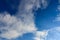 Bright and beatiful blue sky with clouds and bird on a sunny day