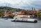 Bright and beautiful autumn view on Vltava river and tourists ships