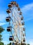 Bright, beautiful Ferris wheel in blue sky