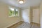 Bright beige empty room with grey hardwood floor