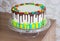 Bright birthday cake with chocolate on a light background