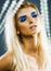 Bright blond young woman with fashion style makeup posing sensual