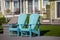 Bright blue Adirondack plastic chairs in the Oregon Coast; vacation and seaside mood