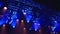 bright blue ceiling spotlights lights the stage