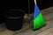 Bright blue and green synthetic street mop with black bucket and a scoop