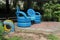 Bright blue painted chairs made from recycled auto tires