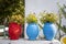 Bright blue and red ceramic pots with flowers on the street, against the white walls, street decoration, island of Kos, Greece