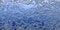 Bright blue shiny crushed foil texture, frosty winter feeling. Wide panorama background.