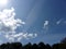 Bright blue skies and clouds overhead in the summertime 1