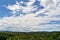 Bright blue sky with forest and mountain is elements for background.