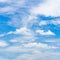 bright blue sky full with cumulus clouds