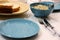 Bright blue stylish accent on the relaxed atmosphere of the table. Unpresentable appearance of photos of everyday dishes