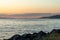 Bright blue water of puget sound along shoreline of washington