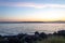 Bright blue water of puget sound along shoreline of washington