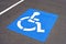 Bright blue and white handicapped parking symbol