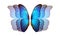 Bright blue wings of a colorful tropical morpho butterfly on white. flight effect. flutter of wings