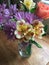 Bright bouquet of spring flowers in glass vase