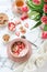 Bright breakfast table with yogurt, granola and dried strawberries bowl