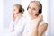 Bright call center office. Two blonde women in a headset