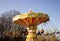 Bright carousel with chains spinning around in the park with the children.Motion blur.