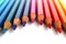 Bright color pencils horizontal wave on white background with violet central pencil on focus
