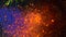 Bright colored dust explosion on a black background, art concept. Motion of blue and orange powder inks, multicolored