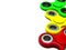 Bright colored fidget finger spinners on white background