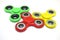 Bright colored fidget finger spinners on white background