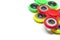 Bright colored fidget finger spinners on white background