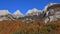 Bright colored forest and peaks of the Churfirsten Range. Autumn