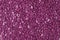 Bright colored granules. Abstract beautiful background. Granules for hair removal. Vivid colorful purple pearl Wallpaper. Vibrant