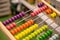 Bright colored hand abacus. Children`s wooden toy for the study of arithmetic.
