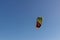 Bright colored parachute from kite surfing in the blue sky. Place for text