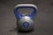 Bright colored plastic kettlebell weight weighing six kilograms