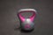 Bright colored plastic kettlebell weight weighing two kilograms