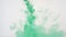 Bright colorful background. Green Liquid ink color blending in water.