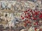 Bright colorful berries hang from a branch in front of bizarre limestone figures of Cappadocia, Turkey
