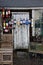 Bright, colorful bouys hanging on a rustic shed