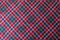 Bright colorful chequered fabric in red, blue and white