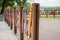 Bright colorful fence in the playground in the form of a pencil. The safety of children during the games