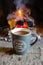 Bright colorful flame, burning wood at the fireplace, coffee cap