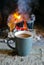 Bright colorful flame, burning wood at the fireplace, coffee cap