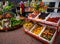 Bright colorful fresh and succulent fruit and vegetables at local food stall.