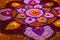 Bright colorful mandala of fresh flowers with burning candles at night festival Diwali