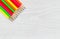 Bright colorful pencil tips on white wood desktop