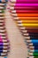 Bright colorful sharpened pencils on wooden table