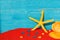 Bright colourful background with yellow starfish end red sand